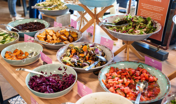 An assortment of fresh food served up at a food counter.