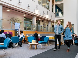 Image of students walking through Atrium at QMU