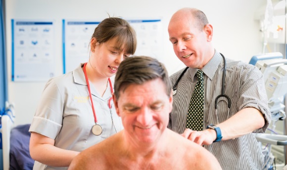 Image of Doctors examining patients back