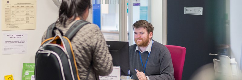 QMU Staff Member Helping QMU Student