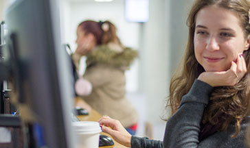 A pair of QMU students working at a computer in the Learning Resource Centre