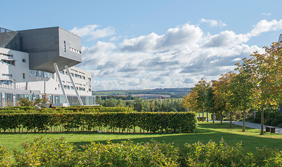 Partial view of Queen Margaret University Campus and grounds on a bright but cloudy day