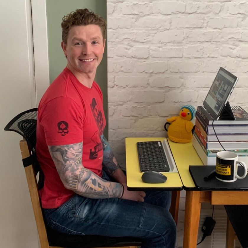 Michael Kennedy sitting at his home desk