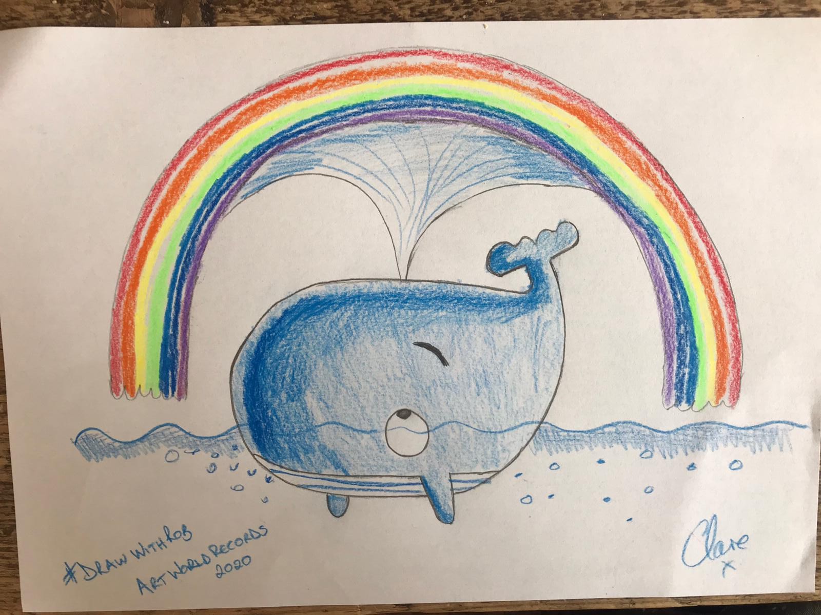 A drawing of a whale with a rainbow overhead