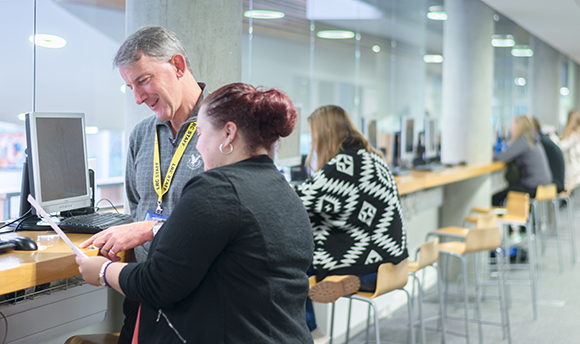 A row of people working at computers in the Learning Resource Centre