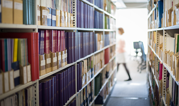 Rows of books in a the Queen Margaret University library