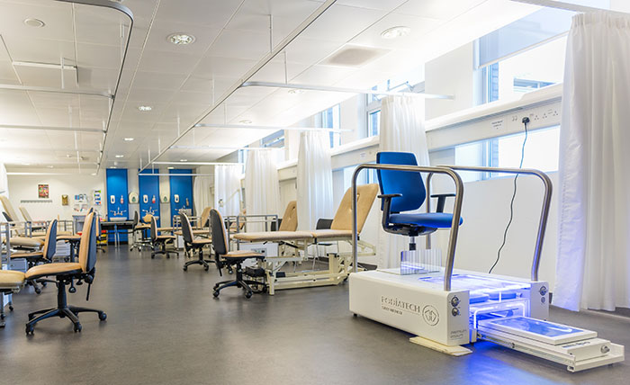 A specialist podiatry lab at Queen Margaret University, with beds, chairs and sinks