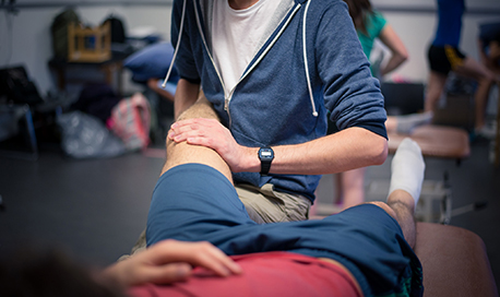 QMU physiotherapy student treating a patient