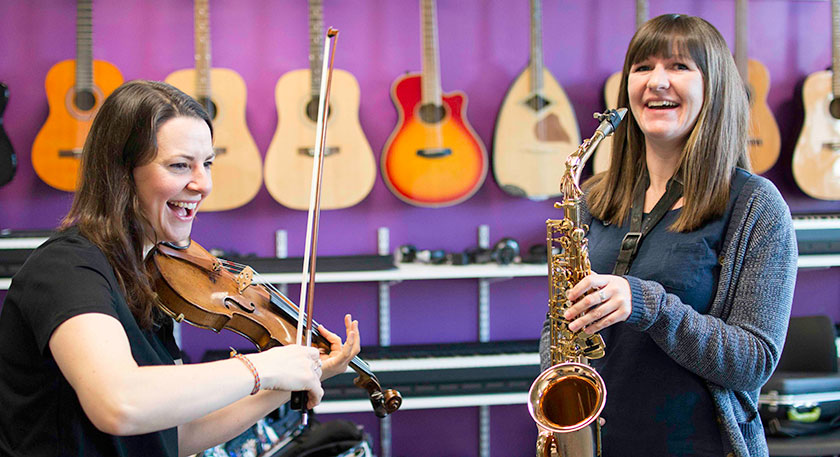 QMU students in music workshop facility playing instruments