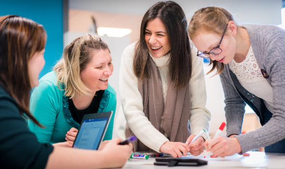 A group working together and laughing