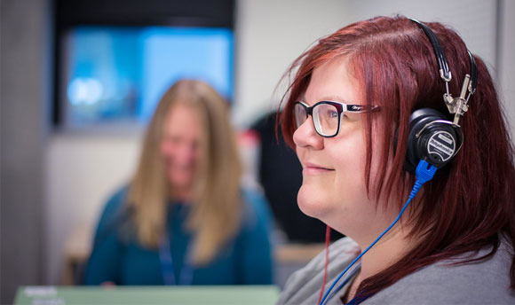 A woman wearing headphones