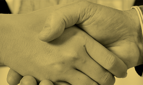 B+W close up photo of two people shaking hands