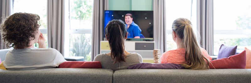 Students watching tv together in QMU Halls