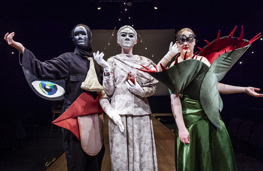 Three students wearing avant-garde clothing in the 2024 Costume Showcase.