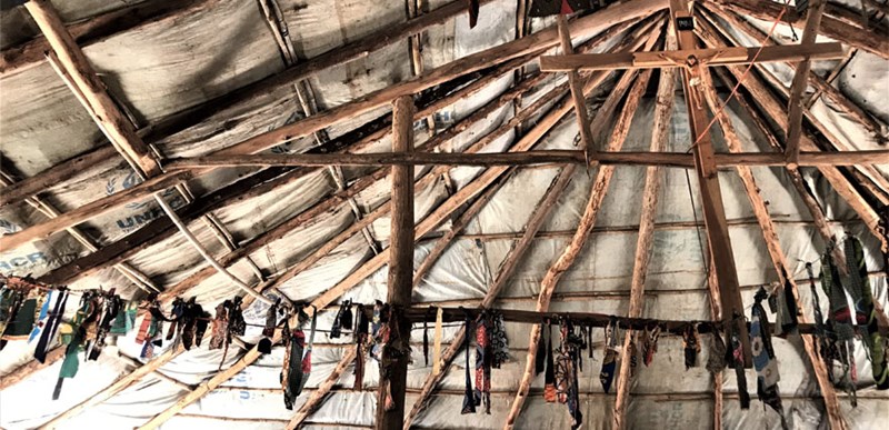 A wooden and cloth church building in the Bibidi settlement of Uganda