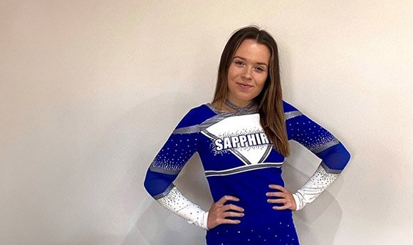 Photo of Rebecca Mcqueen in her QMU Sapphires cheerleading uniform