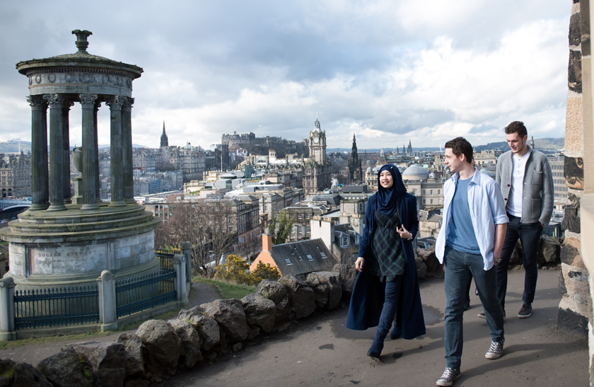 A group of students walking around Edinburgh's Calton Hill