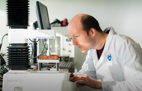 Image of food technician examining food texture