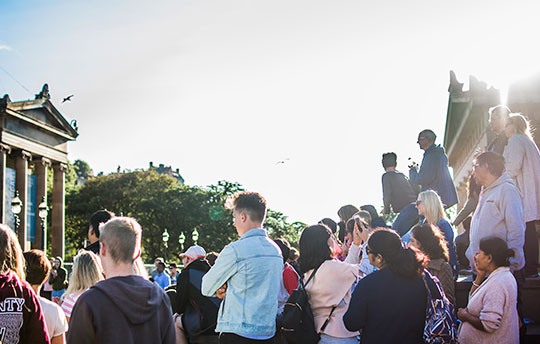 People watching street performance in Edinburgh 