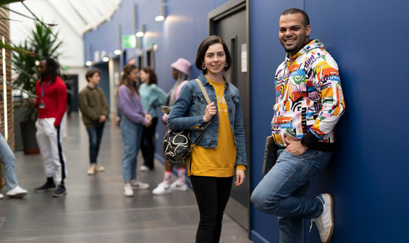 QMU students waiting outside lecture theatre and seminar rooms on campus